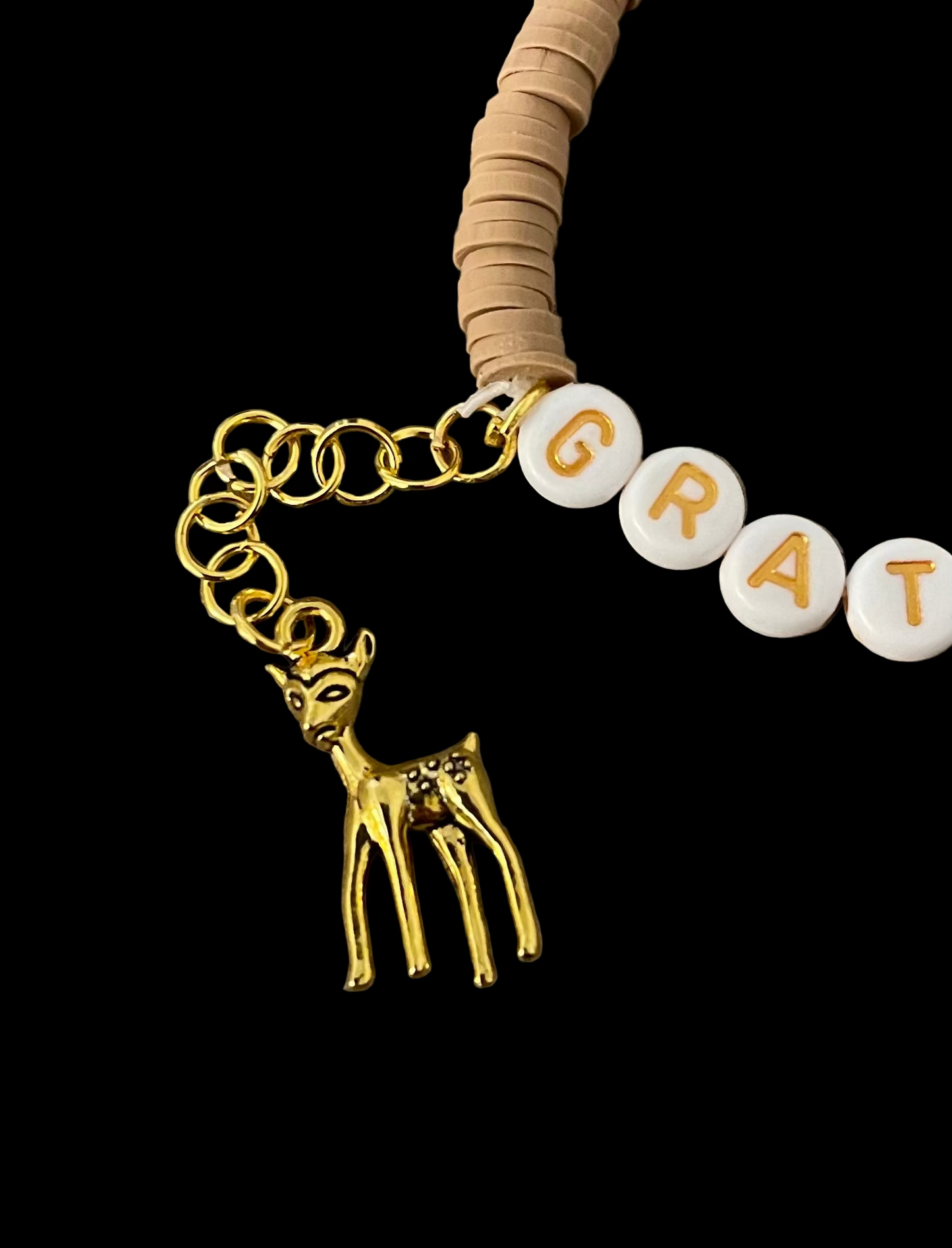 Fall/autumn themed bracelet with autumn colors and a like gold deer charm dangling